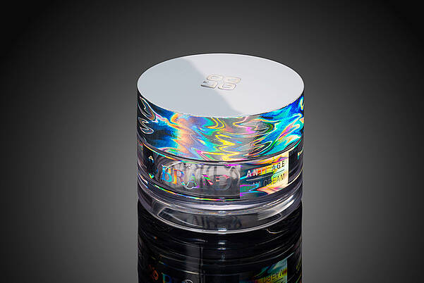 Kosmetiktiegel mit regenbogenfarbenen Hologramm-Effekten
